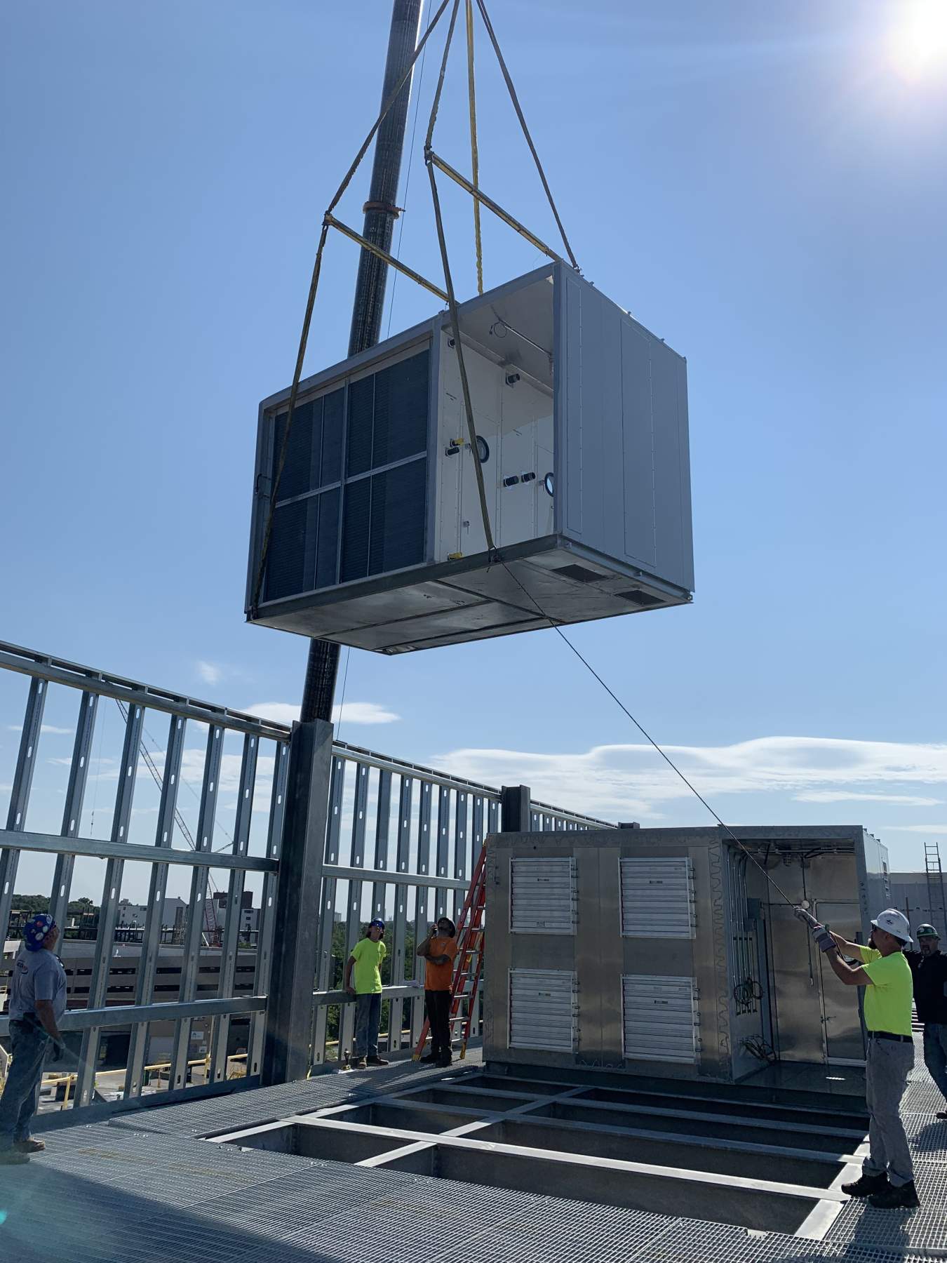 roof top unit being put on roof