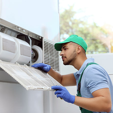 Technician inspect a HVAC system